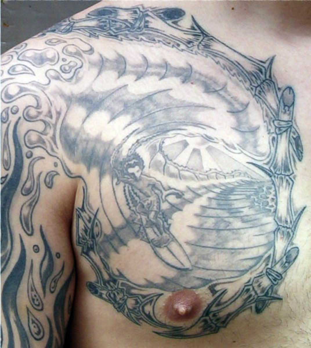 Minimalist surfer tattoo on the rib