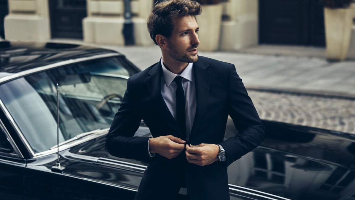 https://www.mensjournal.com/.image/t_share/MTk2MTM3MDAyNjE2ODkwODg1/handsomemaninblacksuitwitholdclassiccar.jpg