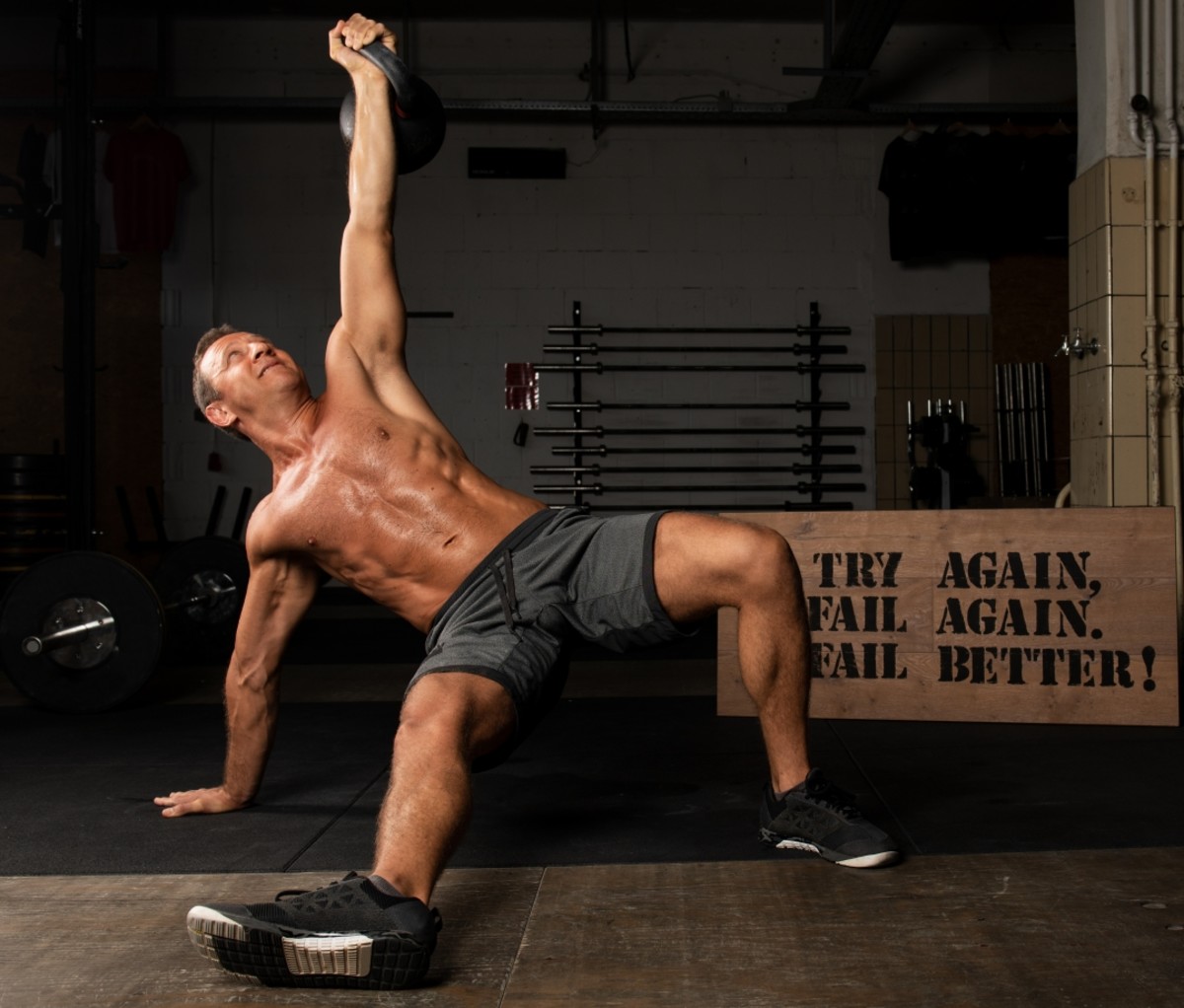 Man doing a Turkish get-up. abs exercises