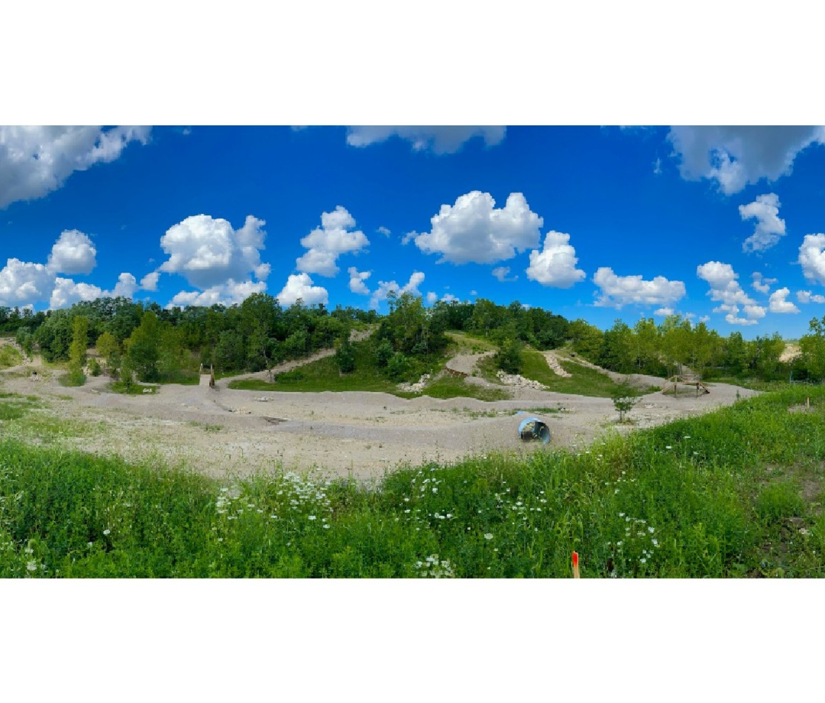 Dirt bike trail and blue sky with clouds in Columbus, OH.