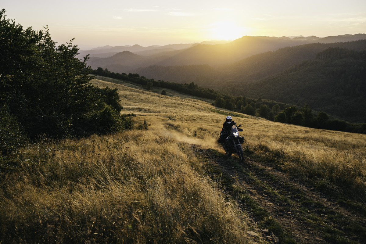 Riding a grassy path adjacent to the Silk Road