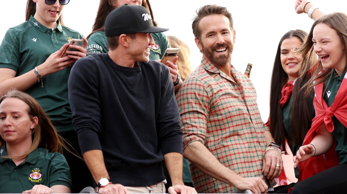 Ryan Reynolds and Rob McElhenney, co-owners of Wrexham, celebrate with players during a Wrexham FC Bus Parade on May 02, 2023 in Wrexham, Wales.