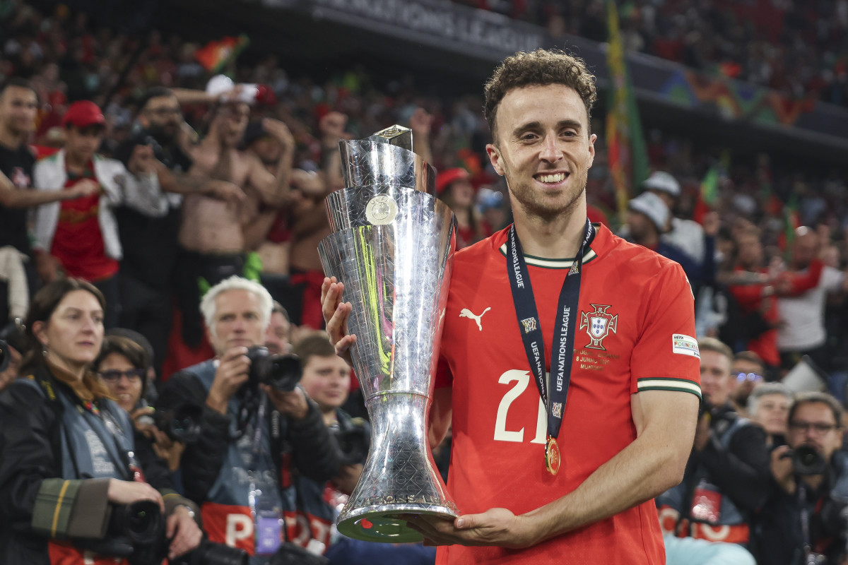 MUNICH, GERMANY - JUNE 08: Diogo Jota of Portugal poses for a photograph with the UEFA Nations League trophy after his team's victory in the UEFA Nations League 2025 final match between Portugal and Spain at Munich Football Arena on June 08, 2025 in Munich, Germany. (Photo by Maja Hitij - UEFA/UEFA via Getty Images)