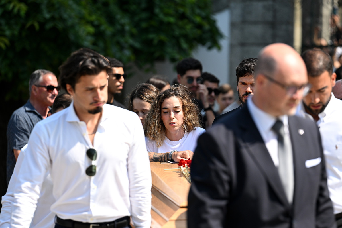 Rute Cardoso, Wife of Diogo Jota, walks with the coffin of Diogo Jota as it is carried out of the Church after a funeral held for Diogo Jota and his brother Andre Silva at Igreja Matriz de Gondomar on July 05, 2025 in Gondomar, Portugal.