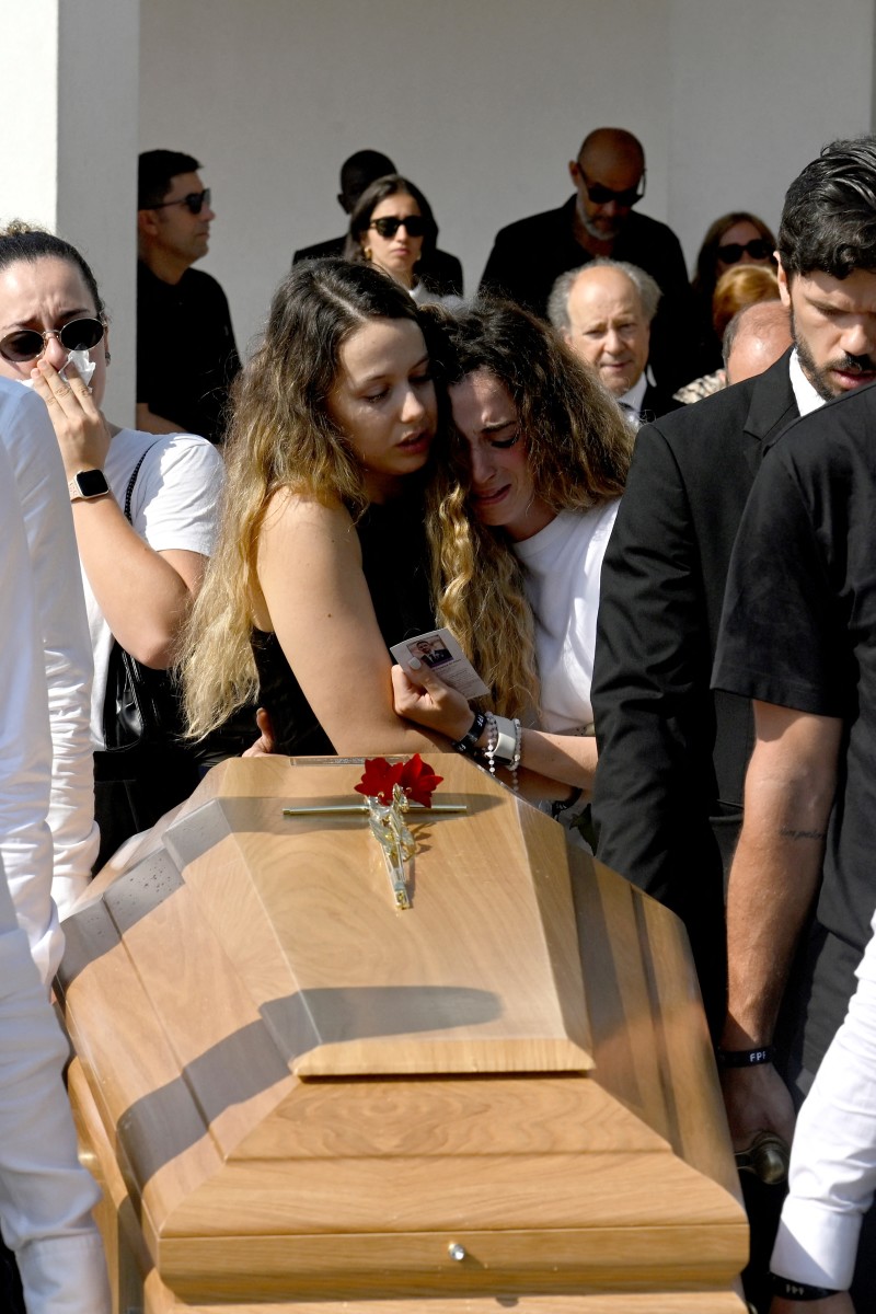 Diogo Jota's wife Rute Cardoso (C,R) and her sister react as former teammates carry the coffin during the funerals of Liverpool's Portuguese forward Diogo Jota and his brother Andre Silva at the Mother Church of Gondomar, on the outskirts of Porto, on July 5, 2025.