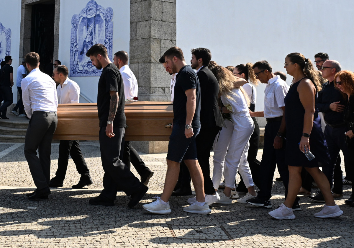 Diogo Jota's wife Rute Cardoso is consoled as the coffins of Diogo Jota and Andre Silva are brought into the Igreja Matriz de Gondomar in the town of Gondomar near Porto.