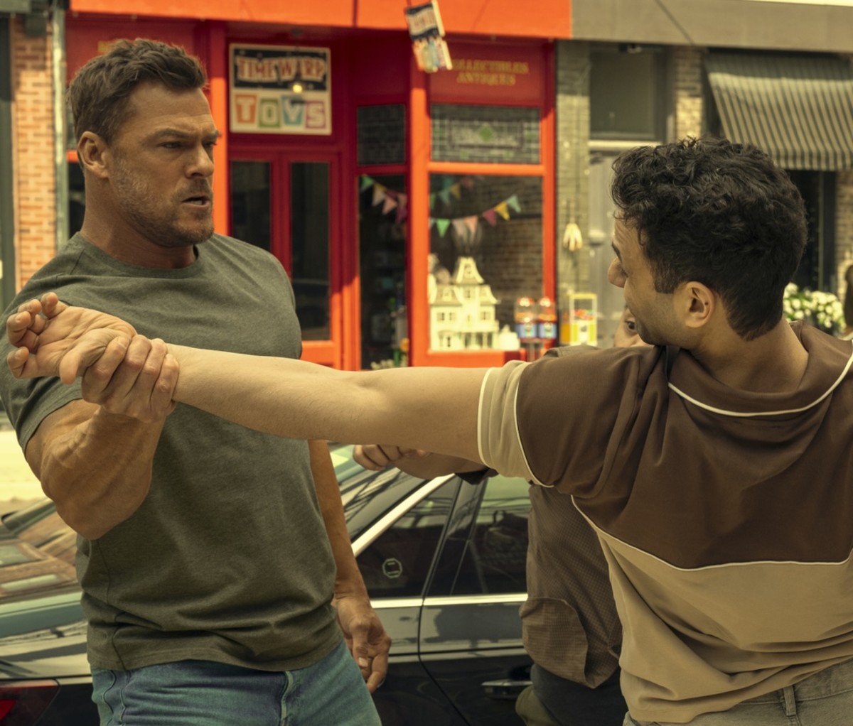 Reacher (Alan Ritchson) taking it to the streets in 'Reacher' Season 3.