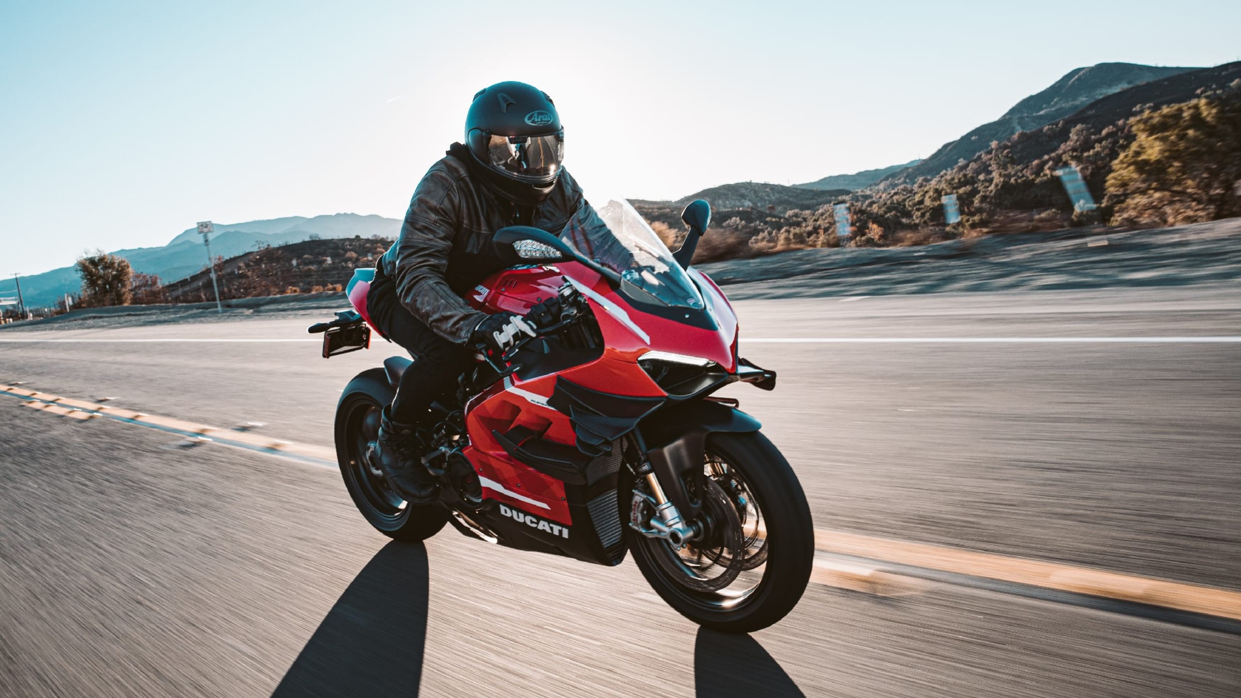 Man riding red motorcycle