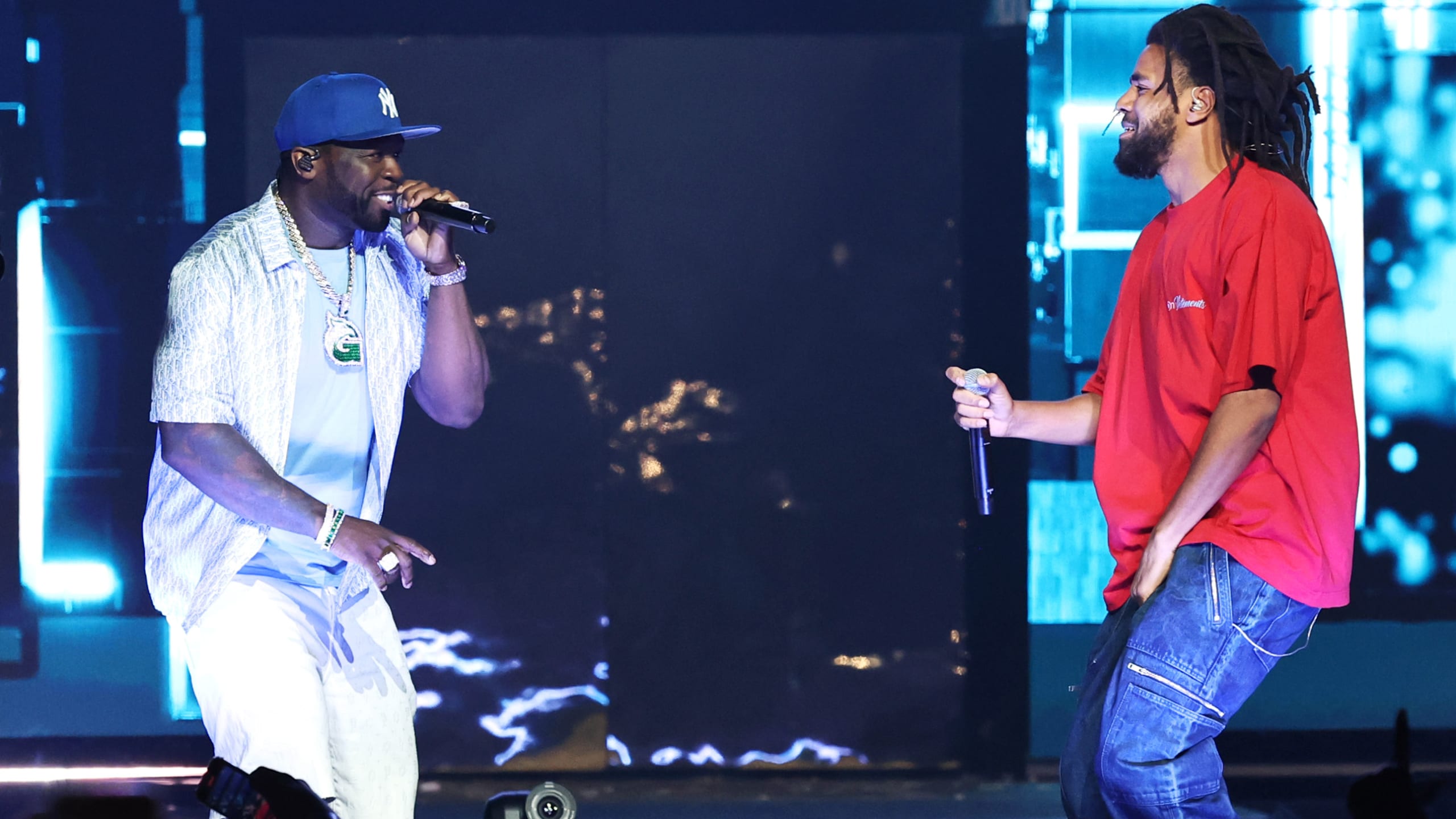 50 Cent and J. Cole performing