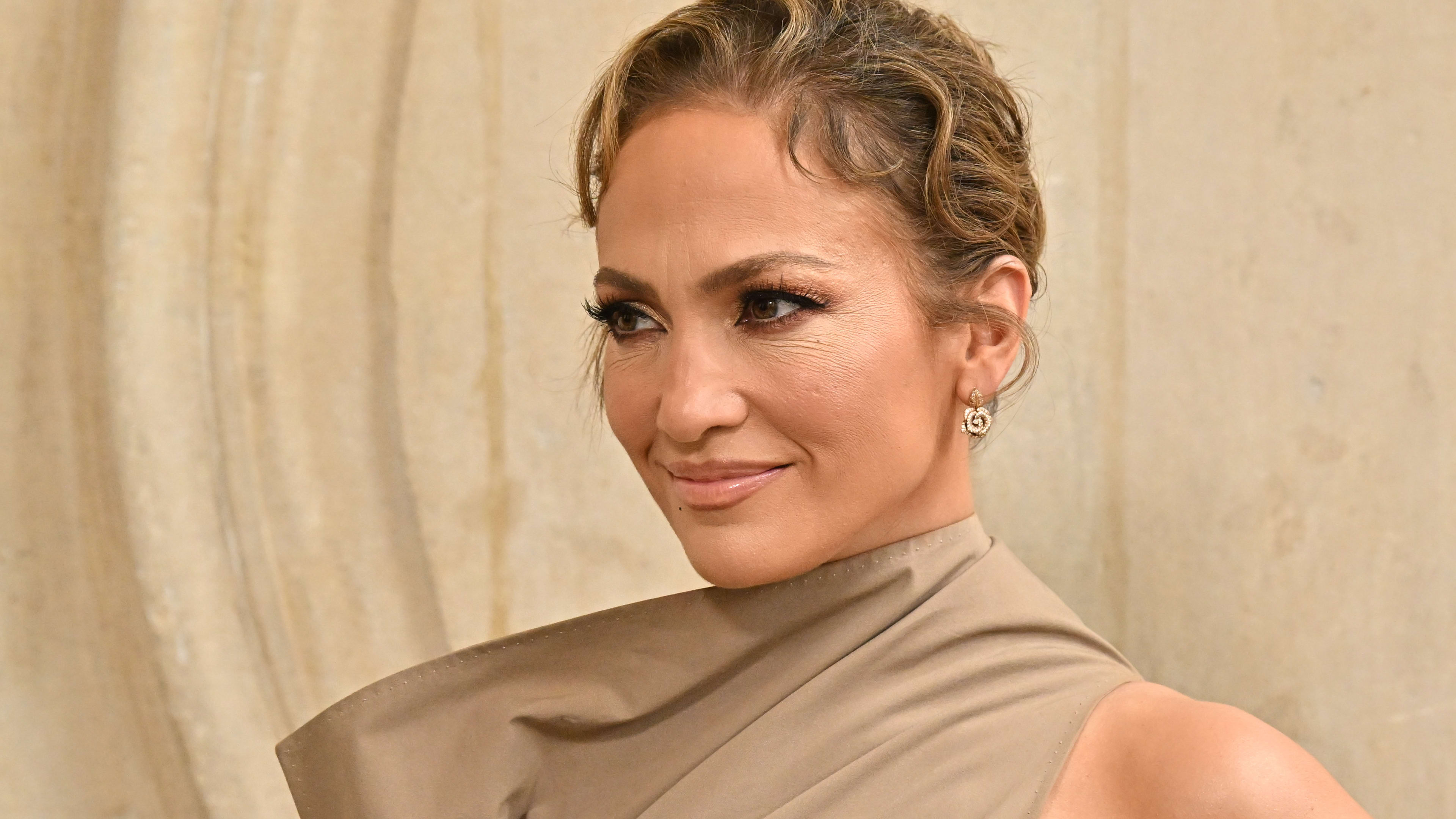Jennifer Lopez Sports White Swimsuit to Celebrate 55th Birthday - Men's  Journal