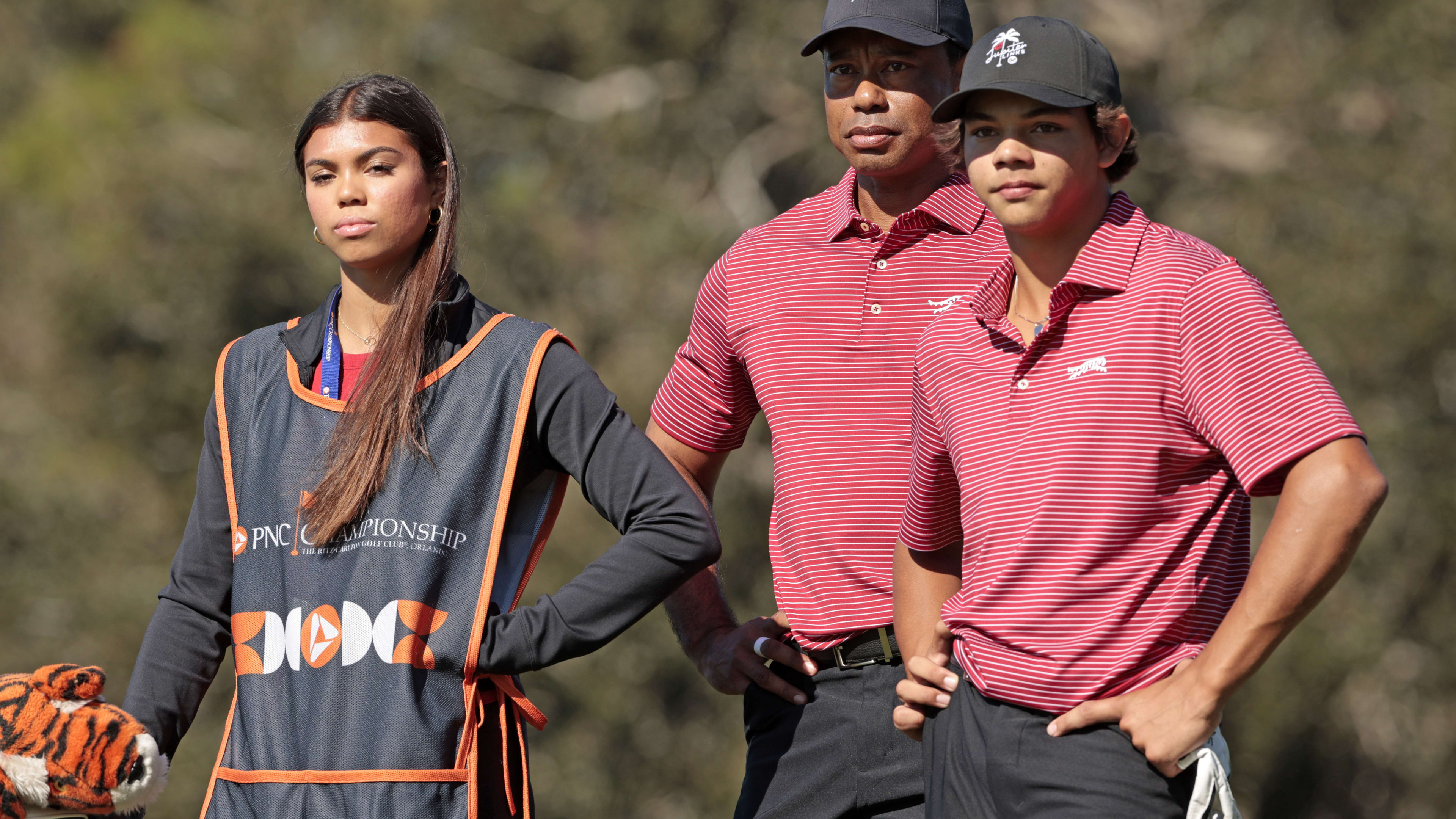 ORLANDO, FLORIDA – DECEMBER 22: Tiger Woods of the United States with his son Charlie Woods and daughter Sam Woods prepare to tee off from the second tee during the second round of the PNC Championship at Ritz-Carlton Golf Club on December 22, 2024 in Orlando, Florida. (Photo by Douglas P. DeFelice/Getty Images) 