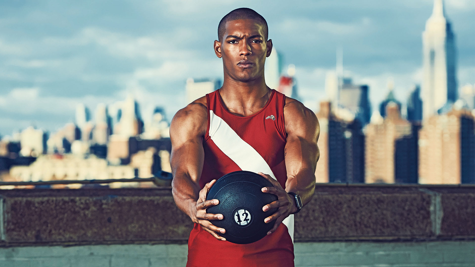 Kneeling Med Ball Partner Twist obliques exercise as part of best abdominal oblique workout
