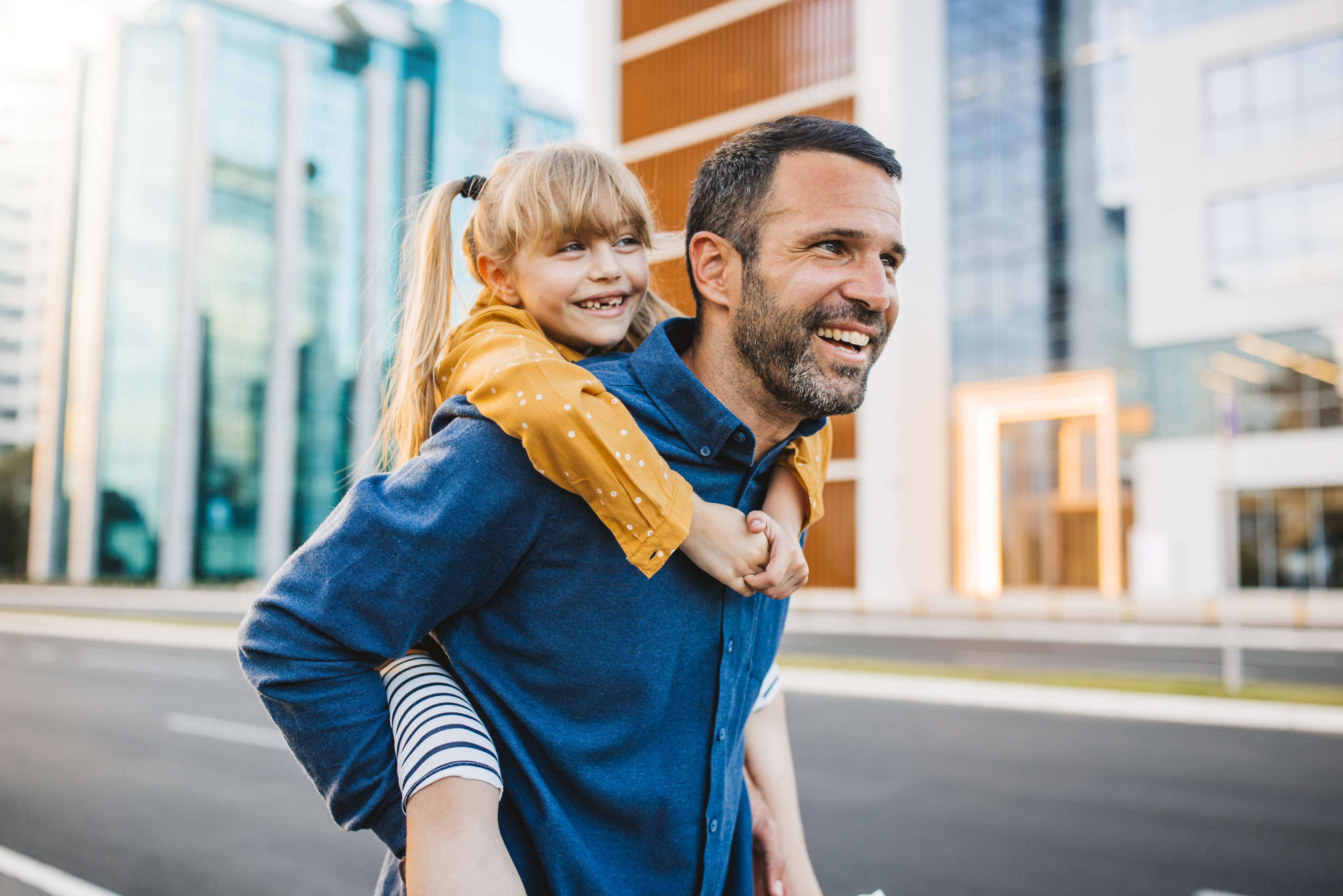 Father and daughter bonding and having fun in the city center.