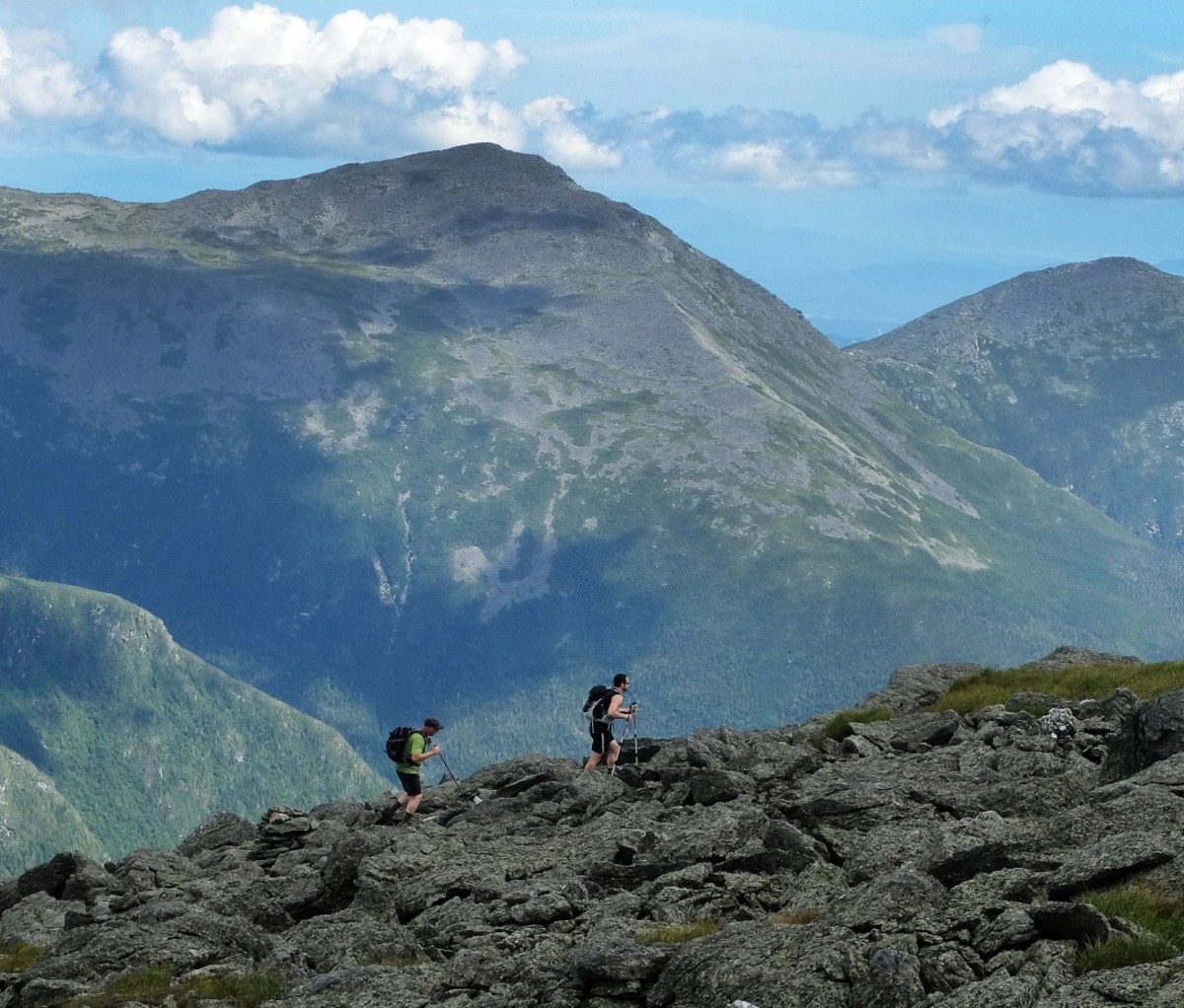 A pair of hikers traverse the trail New Hampshire's Presidential Range on Mount Washington, New Hampshire