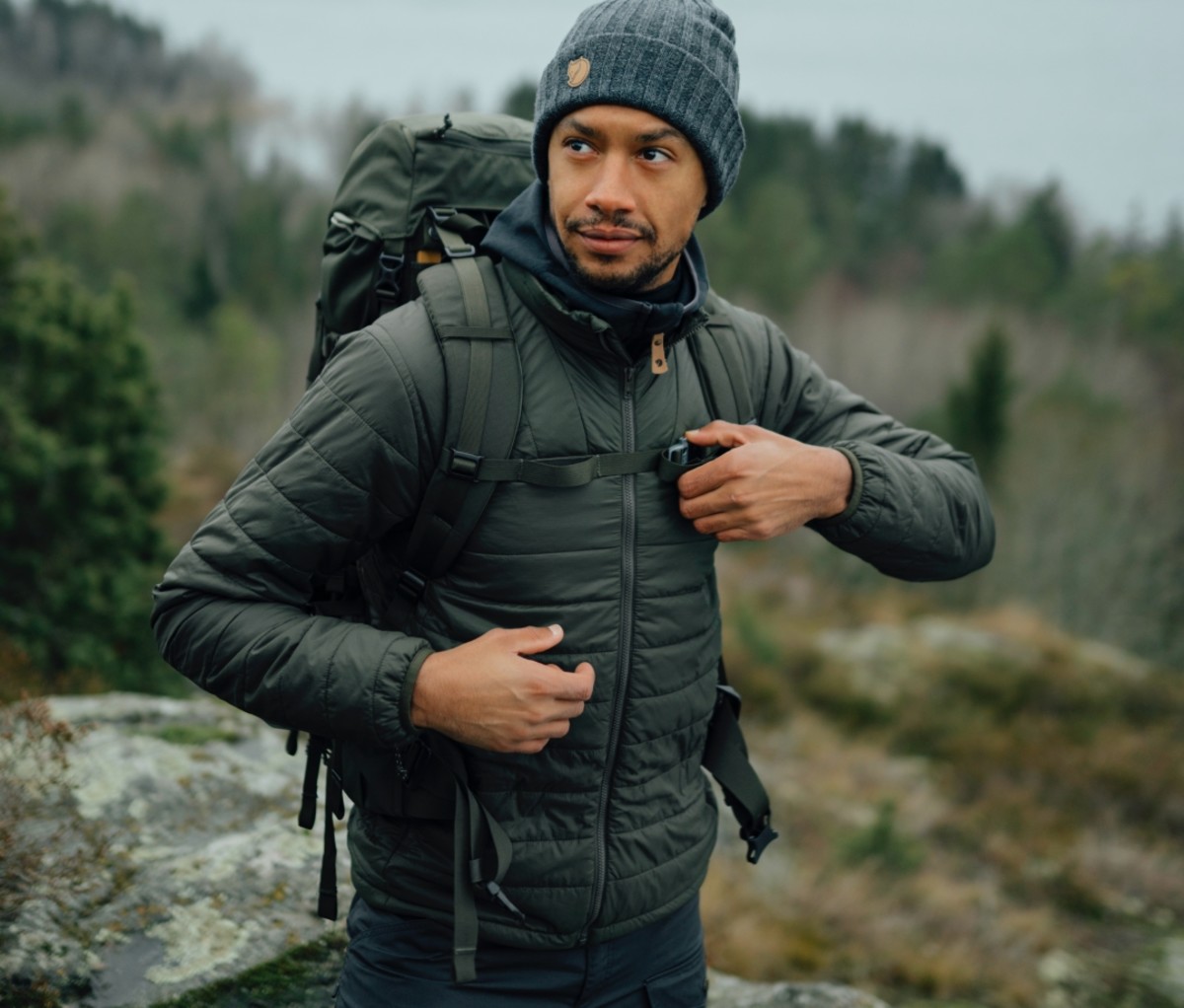 Man wearing a green X-Lätt Jacket