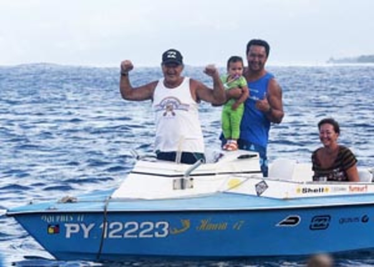 maonis Andy's adopted Tahitian family, the Maoni's, cheer on one of their favorite sons. Photo: Bielmann/SPL