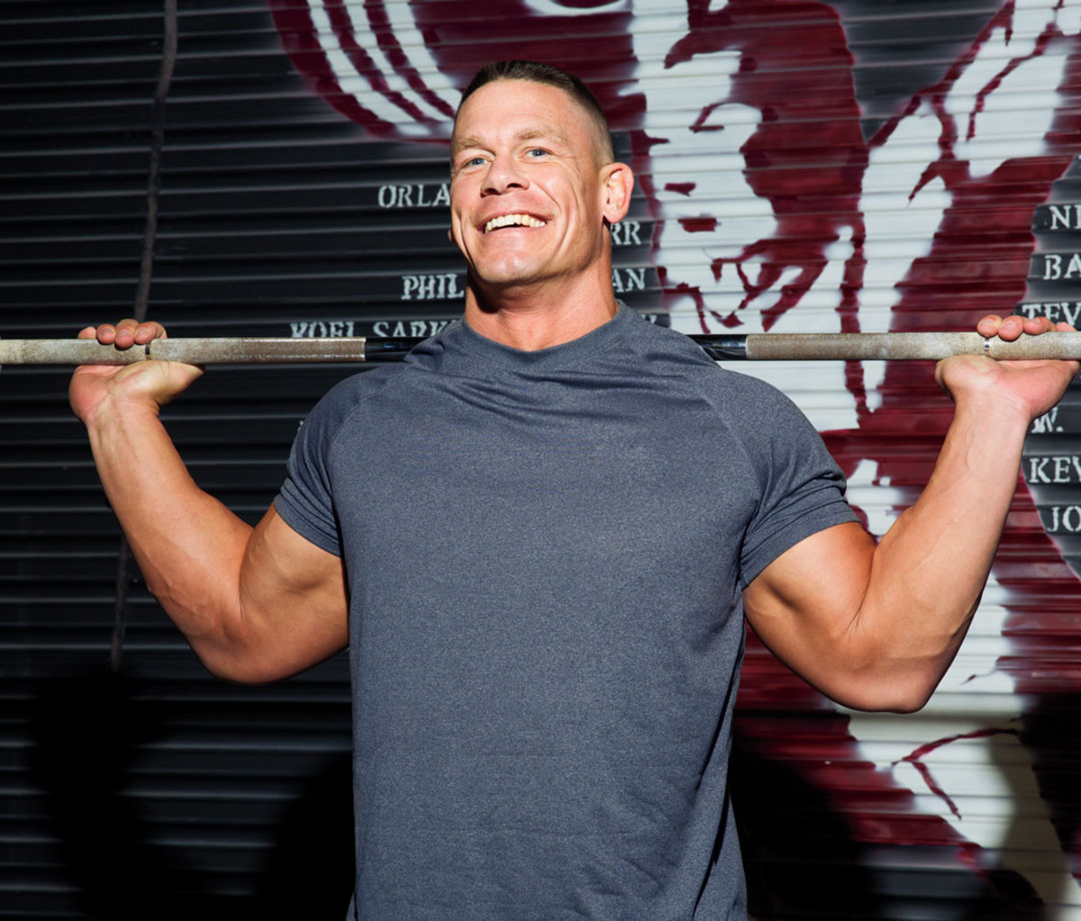 John Cena with barbell on shoulders
