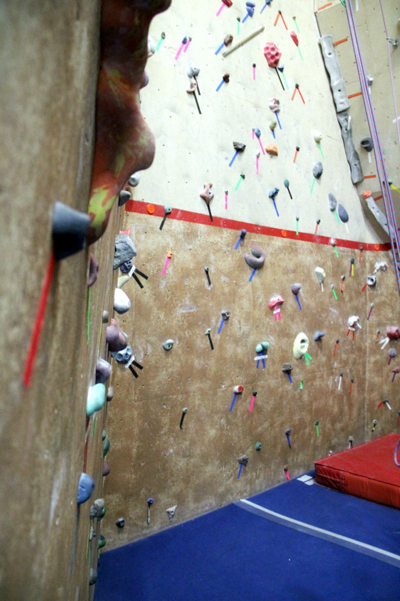While there will be quite a few rocks around you to use, try to only land on the grips labeled with your route's color. Photo by Brandon Scherzberg.