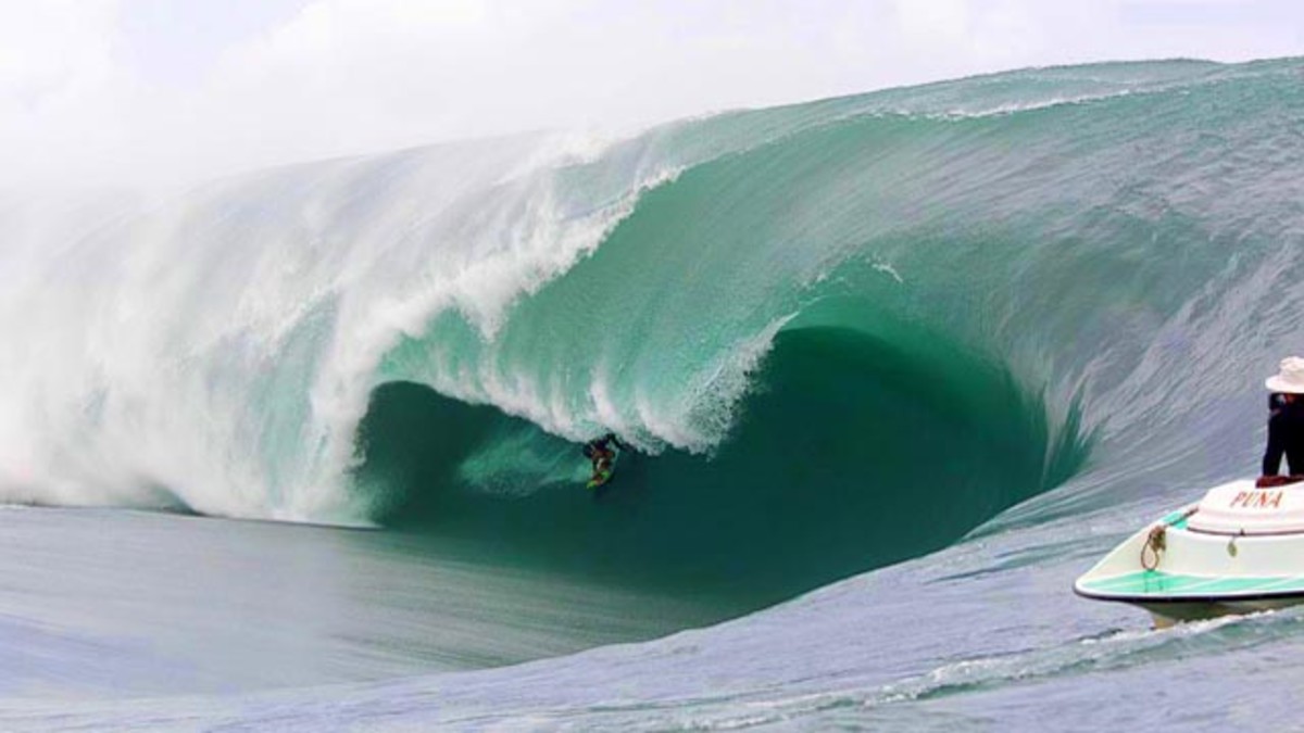 Pato Teahupoo Brazilian charger Pato Texiera. He somehow made it through this section only to be dusted at the very end. Photo: Bielmann/SPL