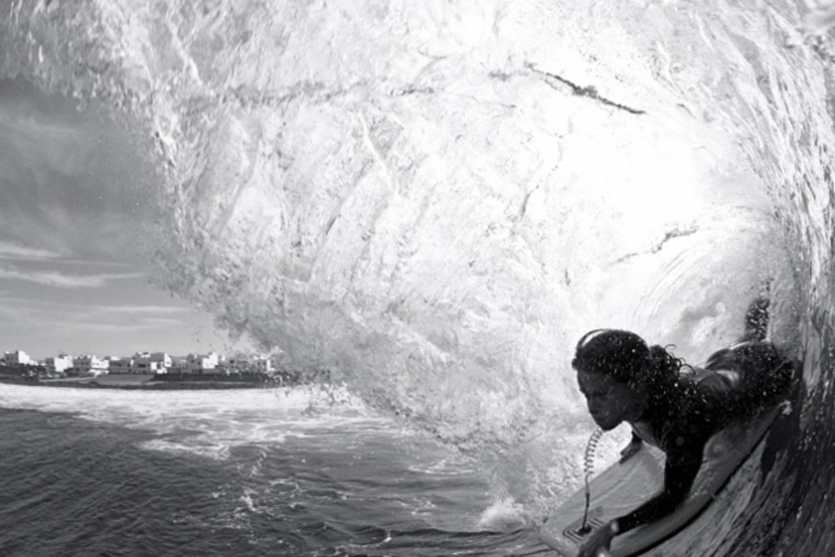 Lauren Frost surfing a local reef break. Photo courtesy of As We Lay