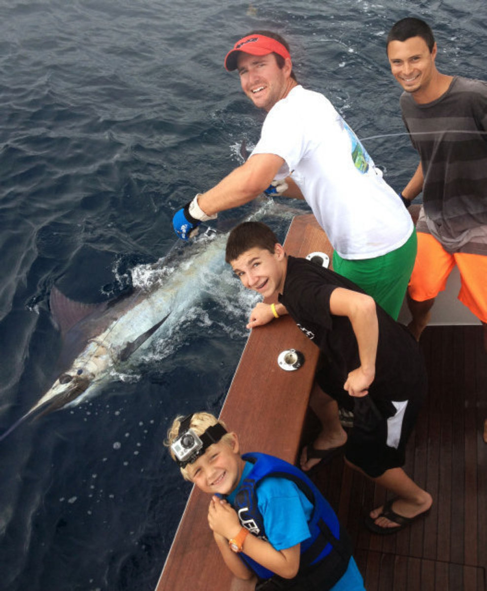 marlin catch with geo. jr. will mate michael bradshaw and mate ryan powell with will's catch photo- george c. powell