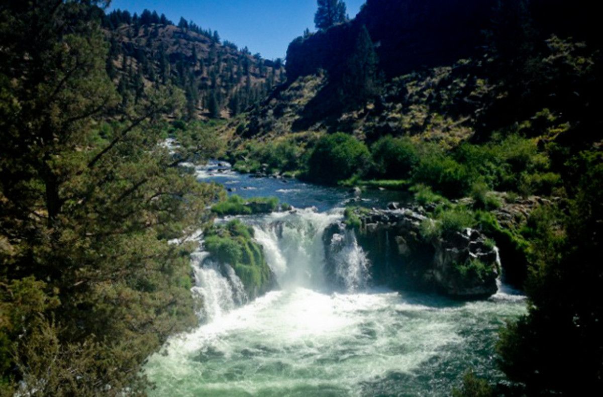 Take a plunge into the deep river swimming hole at Steelhead Falls; photo by Kade Krichko