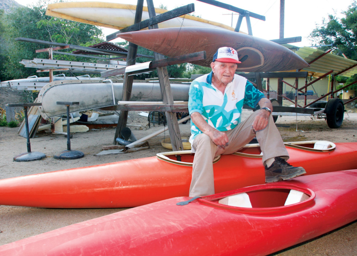 Tom Johnson sits among some of his boats and boat molds which he has made and stores behind his house in Kernville, Calif. Photo: Dan Ocampo