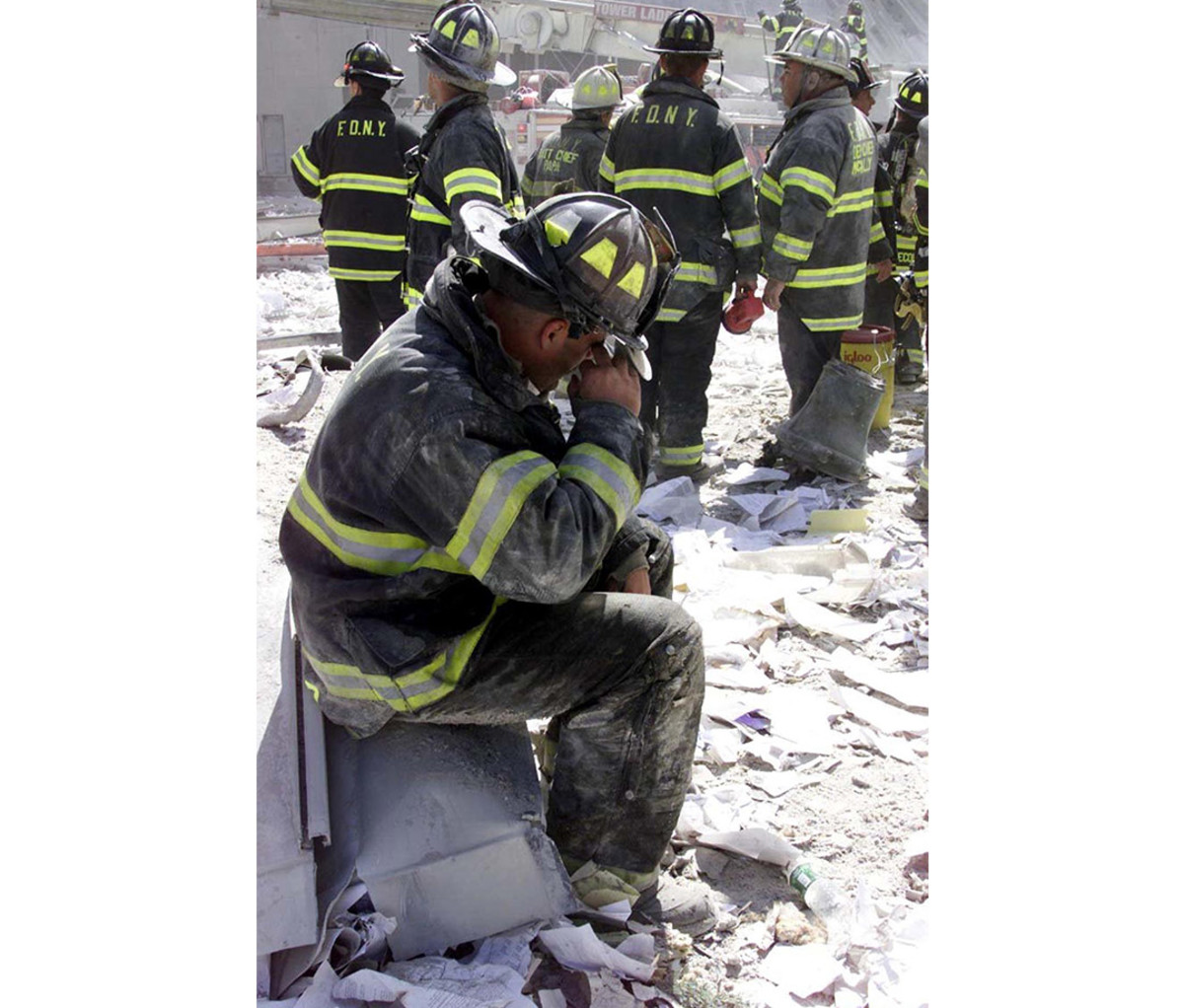 New York Fire Department rescue workers devastated at the site of the attacks