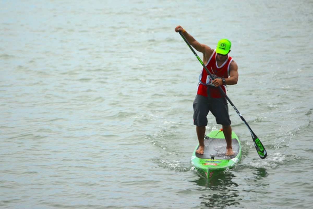 PH-Ching Elite paddler Danny Ching with a slightly staggered stance, mid-twist.