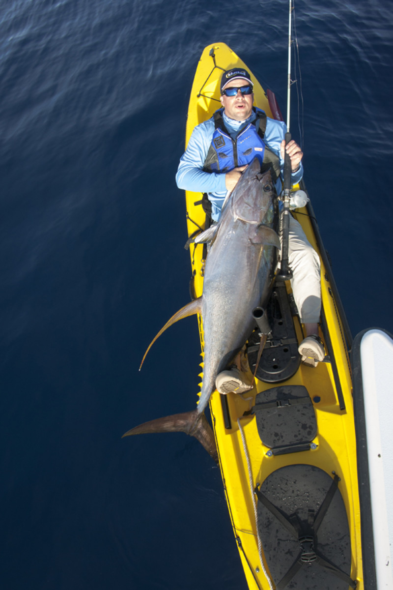 Jeffrey Pierce stamps his big-game kayak fishing ticket. Photo: Jordan Ellis