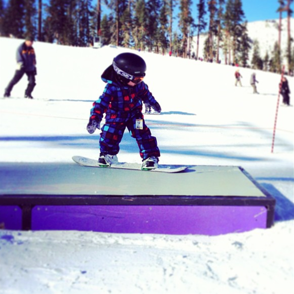 Schlepping gear is a part of parenthood. Use these few tips and you can get your kids snowboarding and skiing sooner than you think.