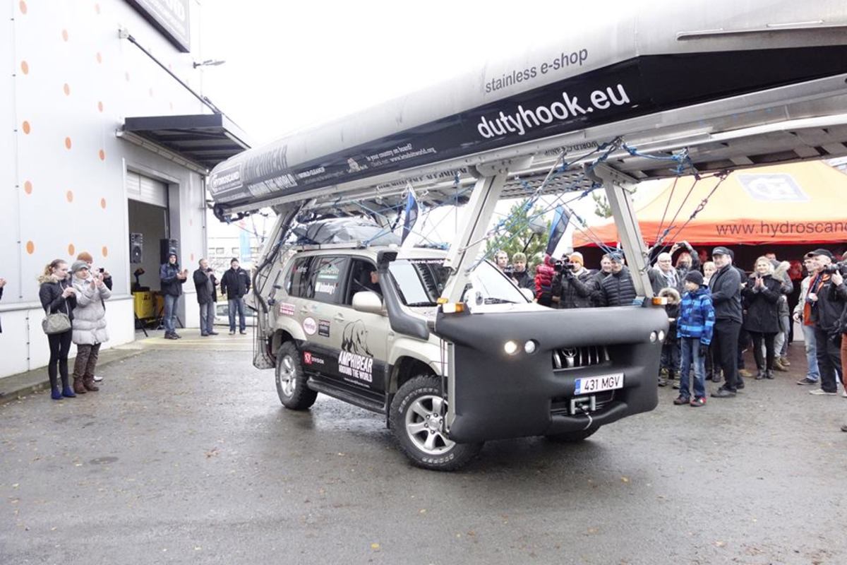 Mait Nilson driving off to start his 37,000-mile-plus journey around the world in his amphibious car; photo from Amphibear's Facebook page