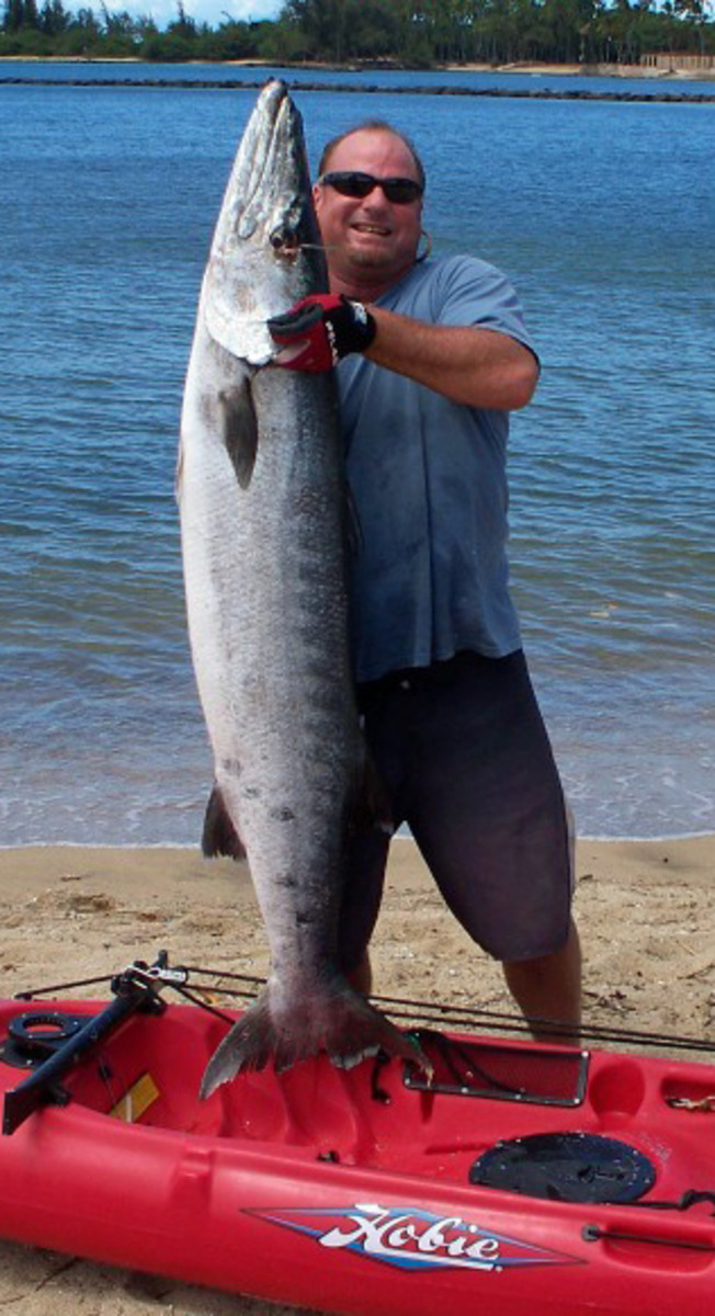 David 'Boogie-D' Elgas caught his 65-pound log 'cuda in just 30 feet of water.
