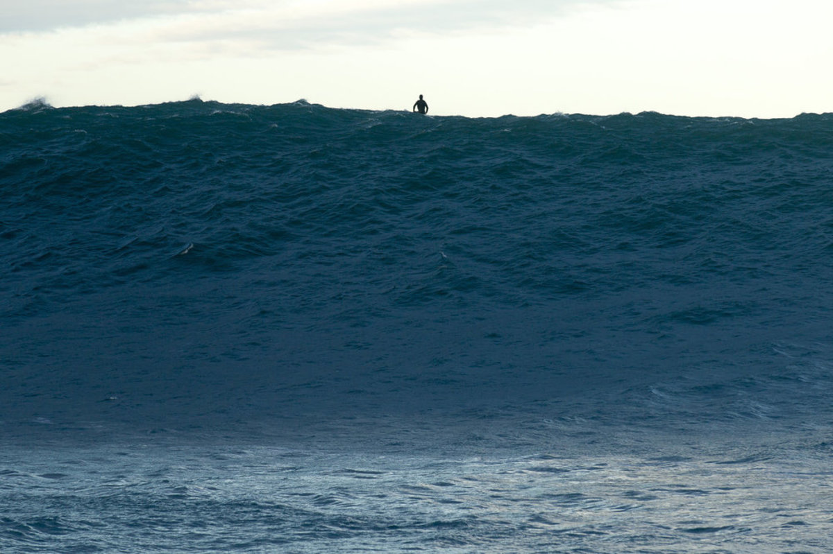 If this surfer were 300 miles closer to the storm, this wave would be torn apart by wind, but in southwest France the conditions were close to perfect as 50-to-60 foot waves marched in.
