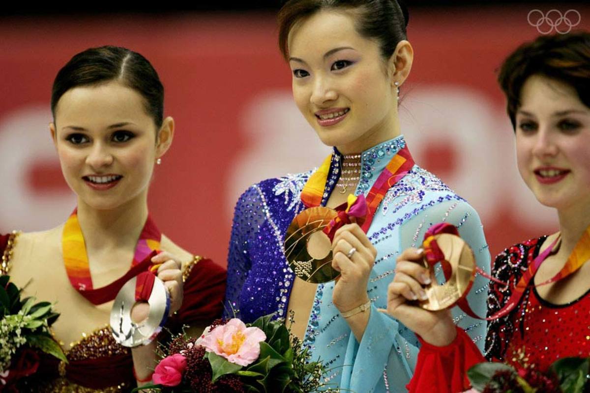 : (L-R) Sasha Cohen of the United States, silver medal Shizuka Arakawa of Japan, gold medal and Irina Slutskaya of Russia, bronze medal pose on the podium after performing in the women's Free Skating program of figure skating during Day 13 of the Turin 2006 Winter Olympic Games on February 23, 2006 at Palavela in Turin, Italy. (Photo by Robert Laberge/Getty Images)
