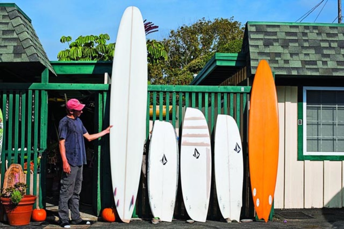 surfer/shaper Ryan Burch with a quiver's worth of asymmetrical surfboards; photo by Aaron Checkwood/TransWorld SURF
