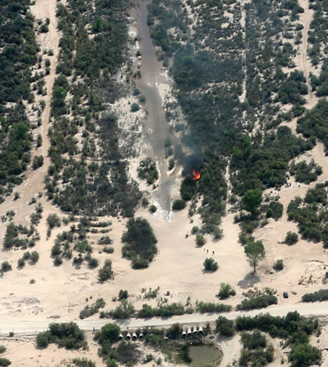 Water arrives at Vado de Carranza, a road crossing about 60 river miles below the Morelos Dam, on April 9. The red splotch is a garbage fire. Photo courtesy of the Sonoran Institute.