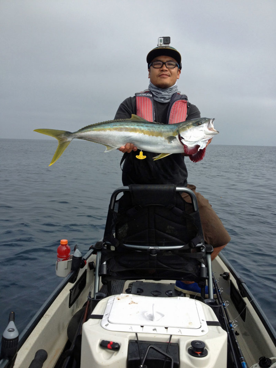 A first: Sea Samurai client Jon cradles his La Jolla treasure, the first guide fish landed on a Hobie Pro Angler 17T