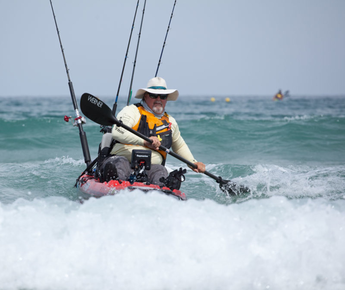 He's past the impact zone, but on most beaches a broken wave will catch a kayak before dry land. Sammons reaches his paddle into the foam and leans on it, a trick known as the low brace.