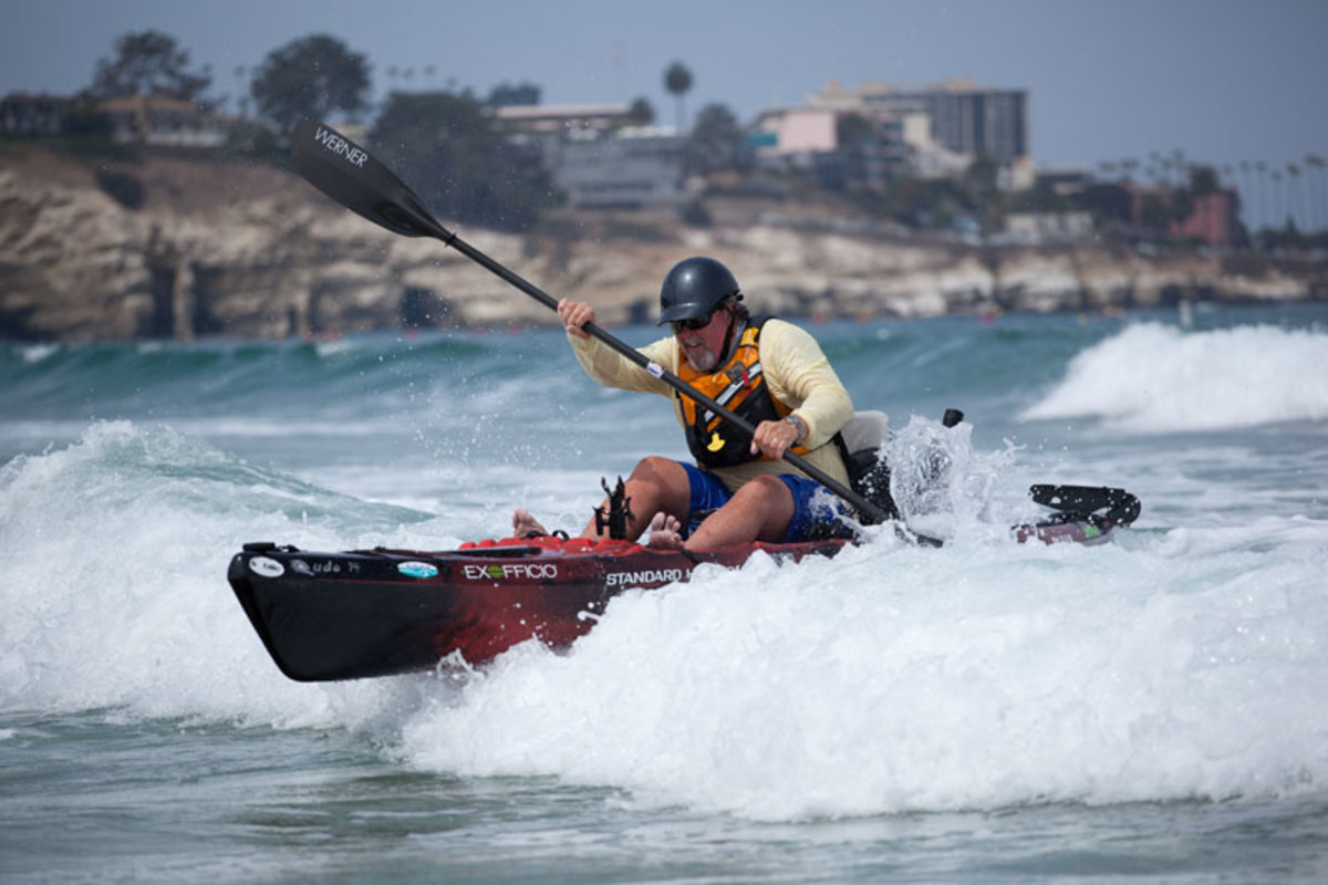 The trick to landing is to AVOID the surf as much as possible, to protect your expensive fishing gear. Notice Jim is paddling in right behind a foamer.