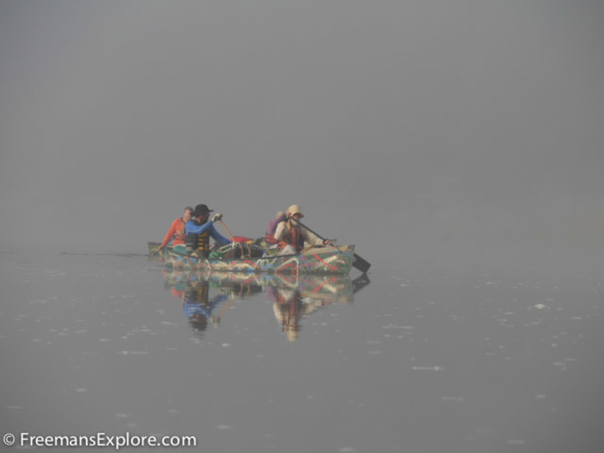 Eurico, Tonico, Norberto, and Hercilio paddling in the cool morning fog on the Rio Branco. Dawn was the best time to paddle because the fog protected us from the heat of the sun. Photo Dave Freeman