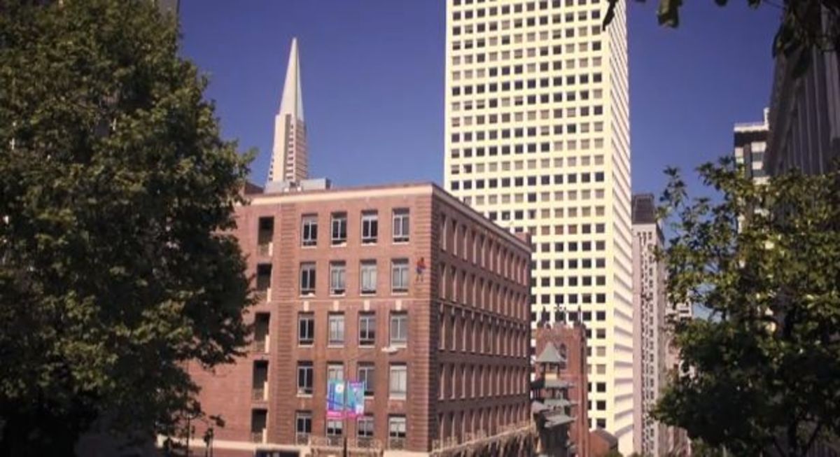Alex Honnold nears top of the building, climbing without ropes or safety gear. Photo is a screen grab from the video