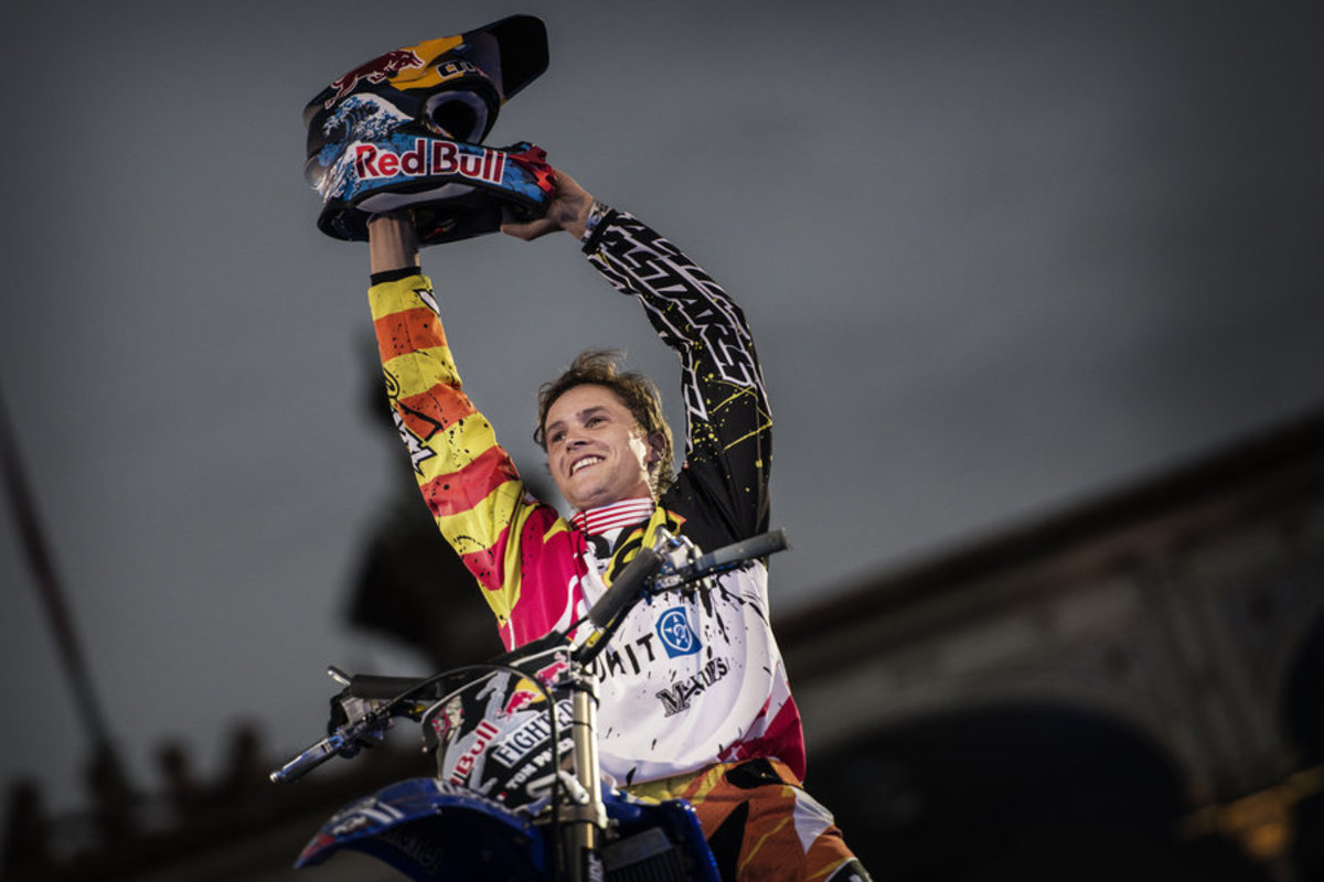 Tom Pages holds up trophy for winning the Red Bull X-Fighters Madrid. Photo: © Joerg Mitter/Red Bull Content Pool