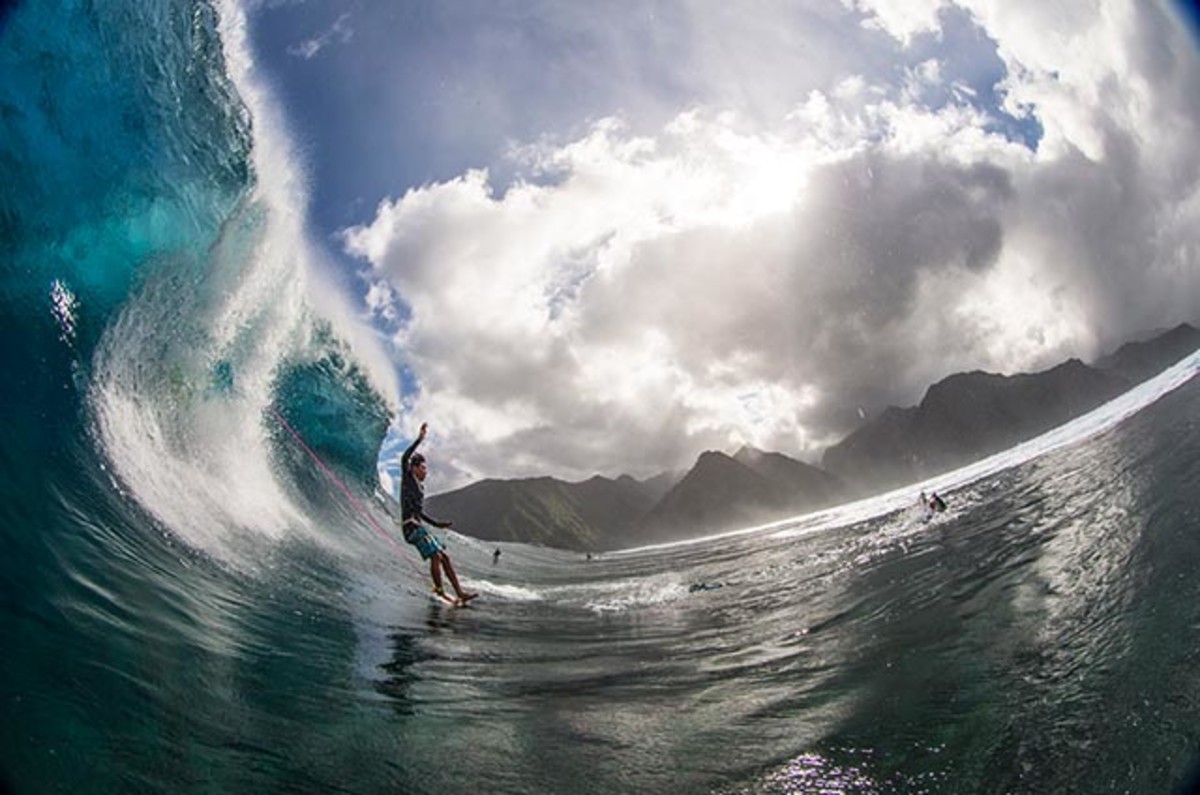 Unidentified taking the plunge at Teahupo‘o; photo by Noyle/Surfer mag