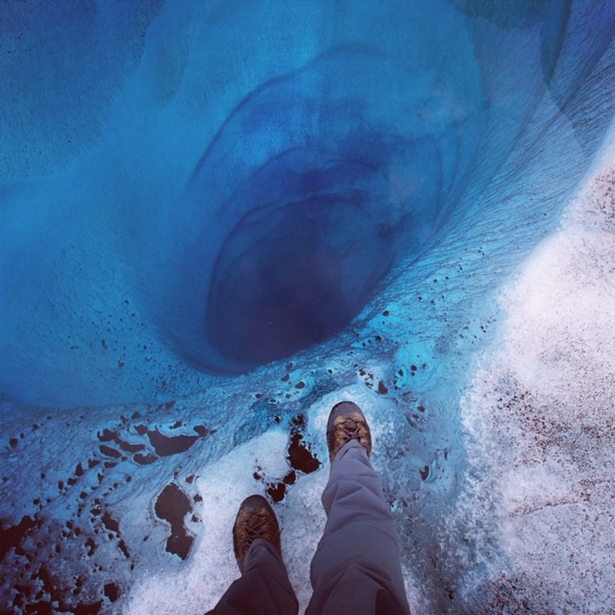 Standing alongside a Ruth Glacier wormhole only looks dangerous. Photo by Aaron Huey from Facebook and Instagram