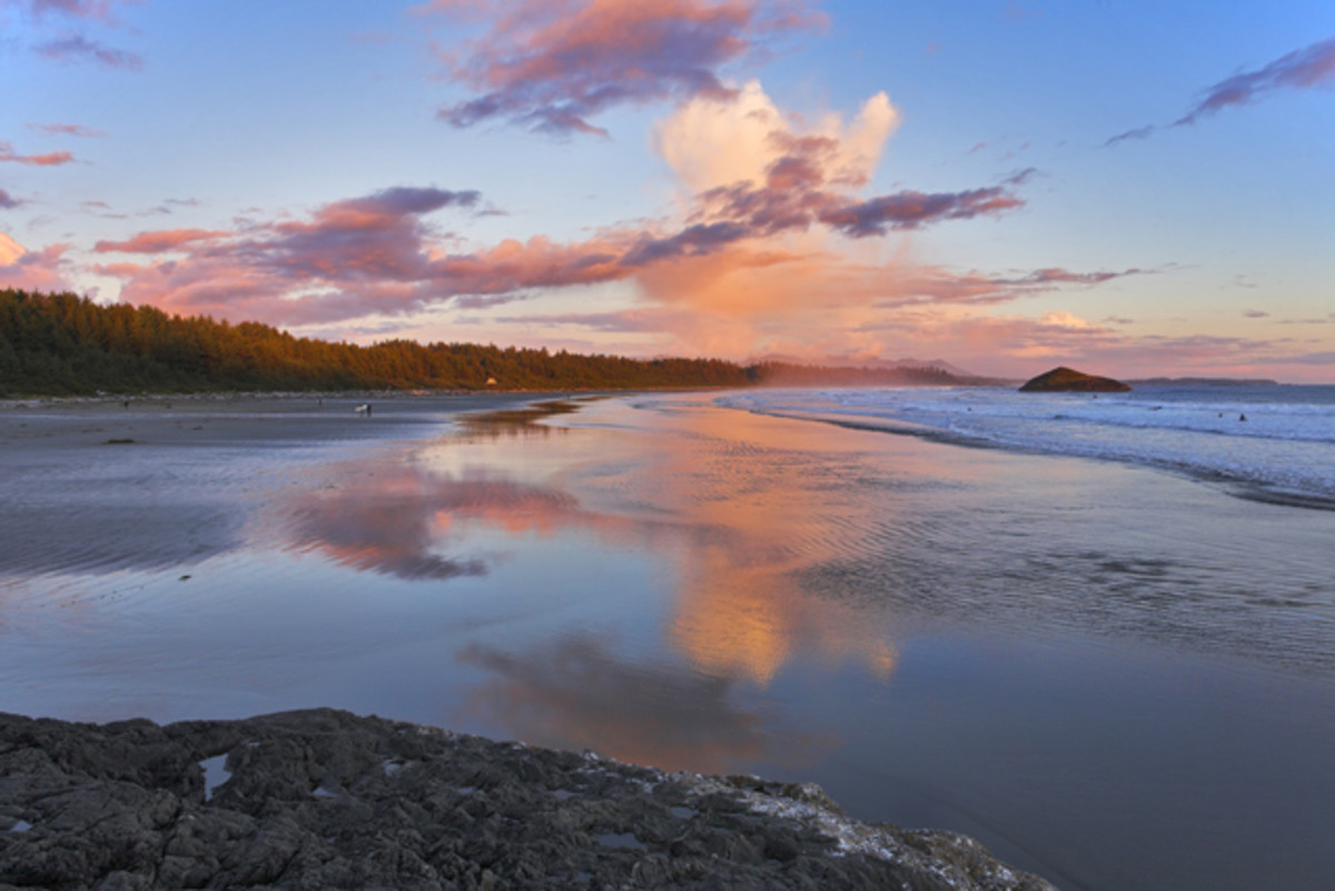 Surfers catch the last light of day in Pacific Rim National Park Reserve; photo courtesy of Shutterstock.
