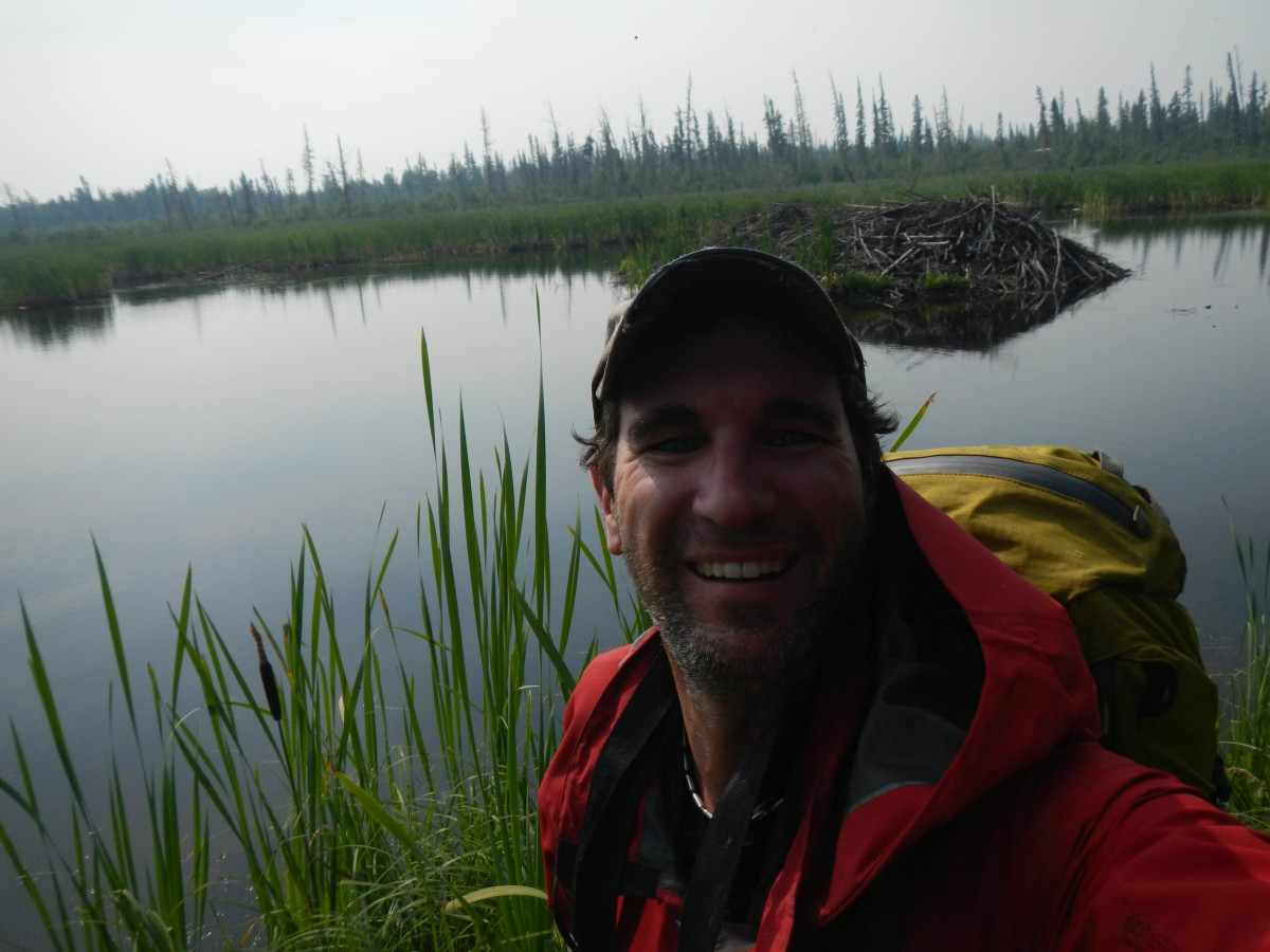 Rob Mark took a selfie atop the world's largest beaver dam with the beaver lodge in the background. Photo courtesy of Rob Mark