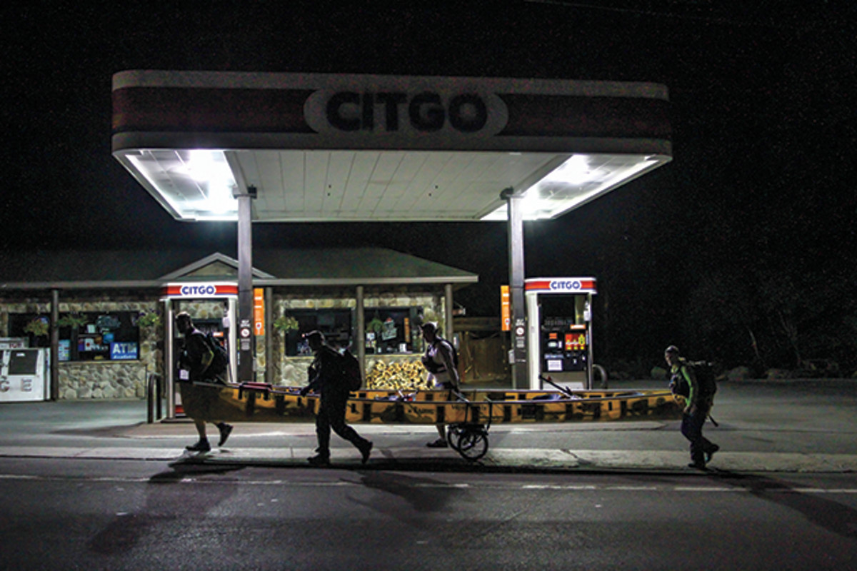 No pitstops for the C-4 Cannonballers passing a closed gas station near Inlet, N.Y.