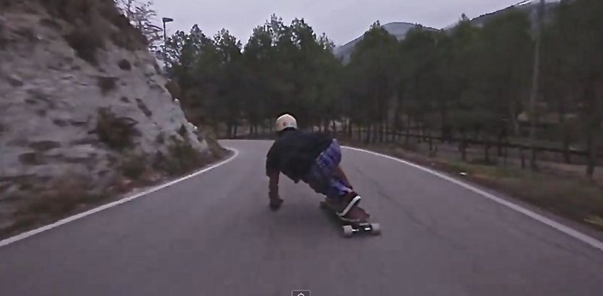 Downhill skateboarder