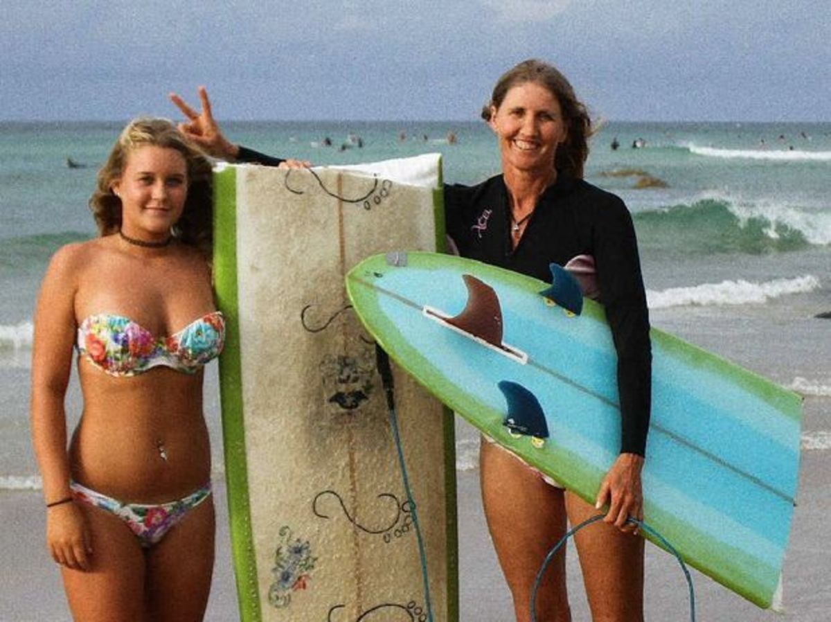 Surfer's board snapped in two